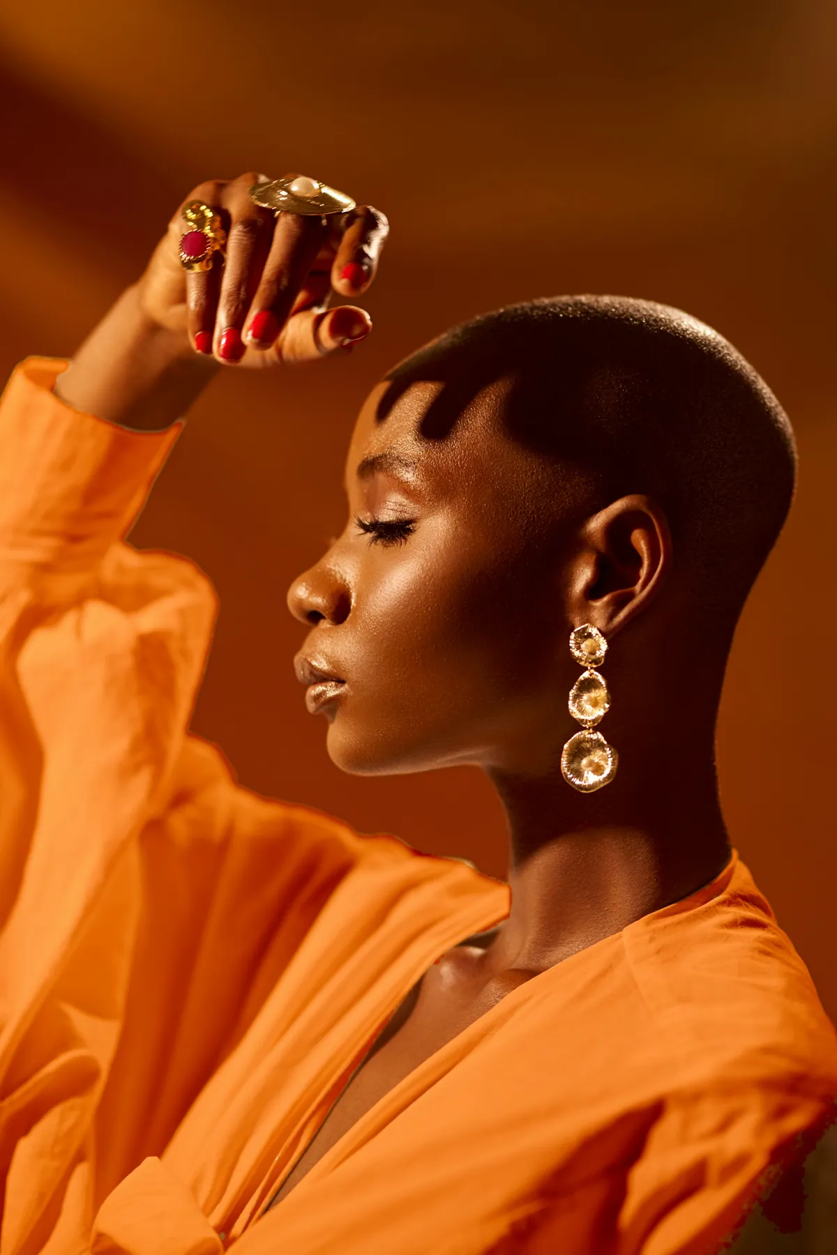 Person posing in orange outfit